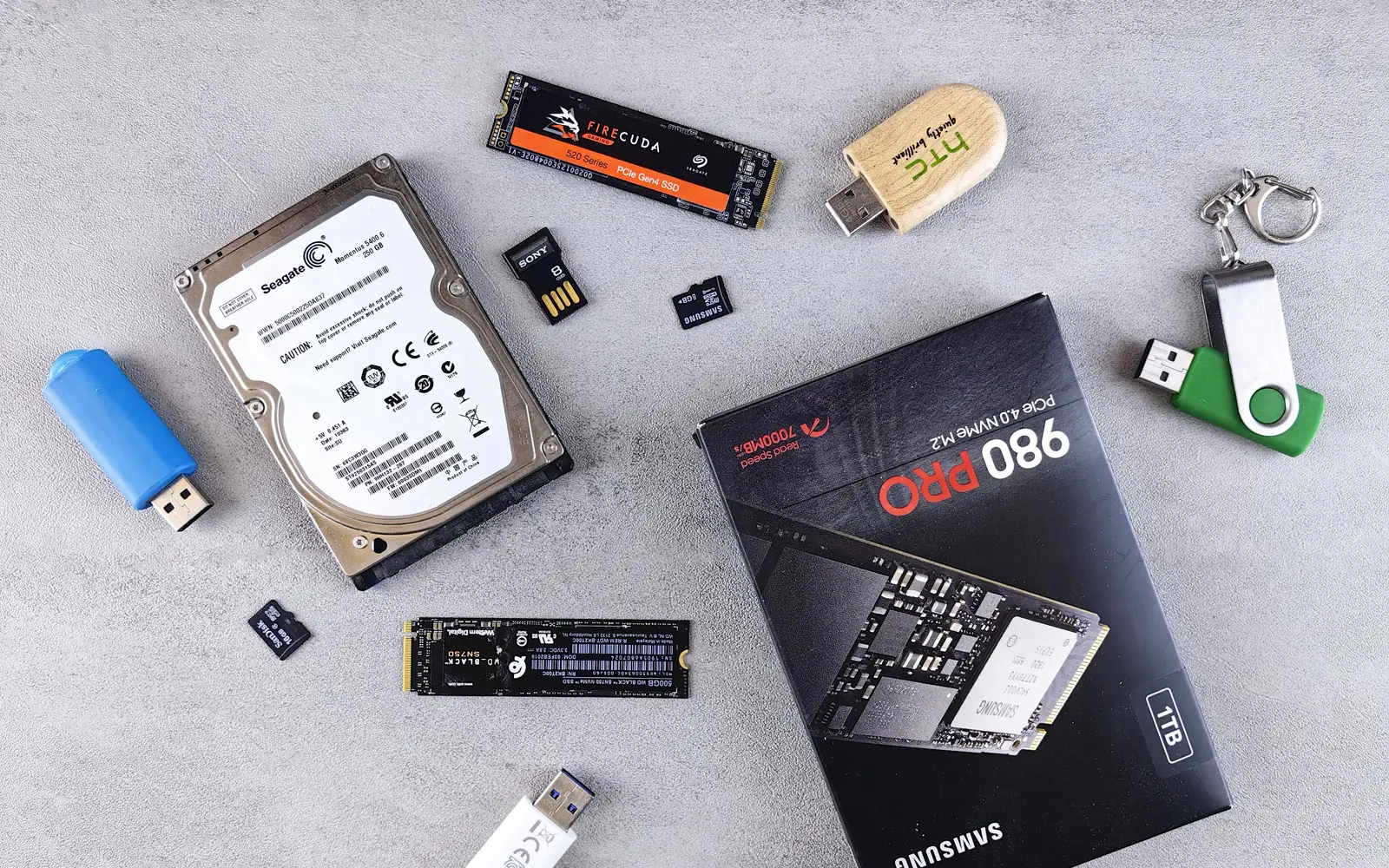 Hard drive, solid-state drives and removable storage devices arranged on a table
